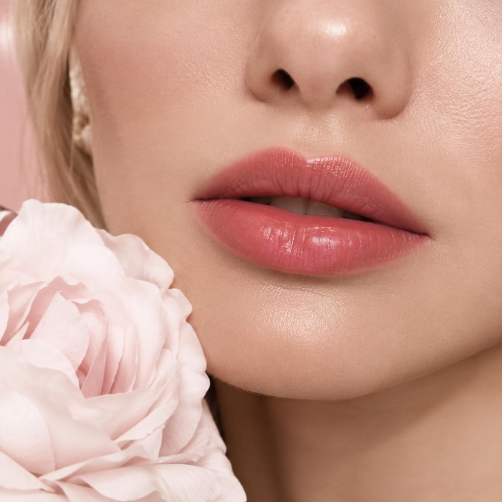 Close-up of lips with soft, natural rosy lip blush color